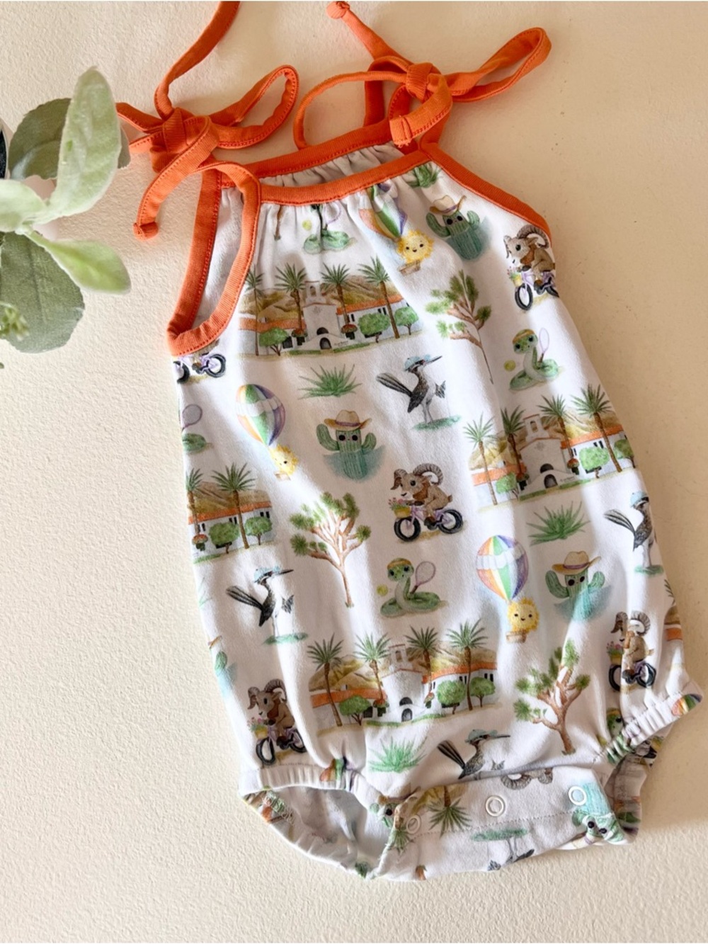 nola tawk shoulder tie onesie